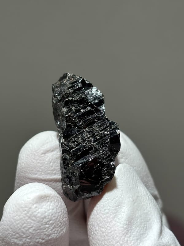 Bladed black cassiterite crystal from Xuebaoding, Sichuan, China, view 3 of 5