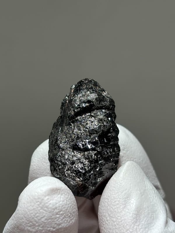 Bladed black cassiterite crystal from Xuebaoding, Sichuan, China, view 5 of 5