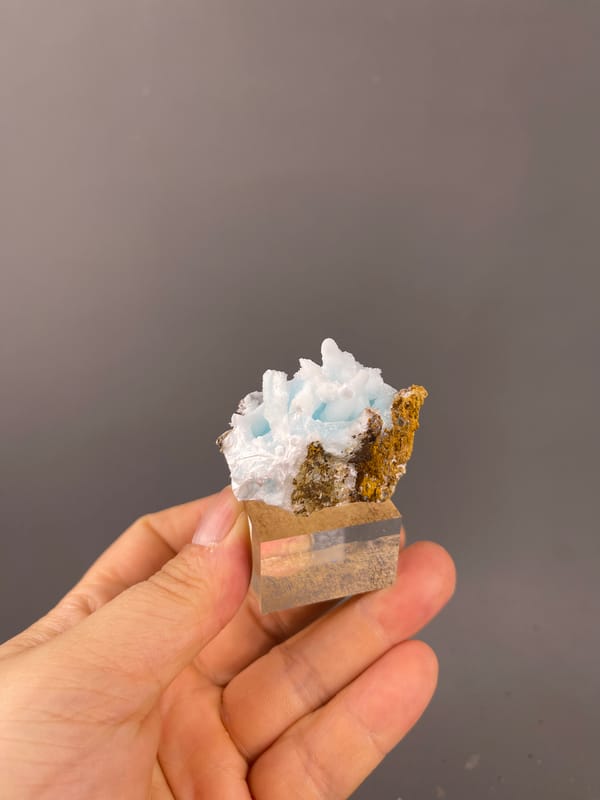 Blue Aragonite specimen from Yunnan, China bearing blue botryoidal base with white blades