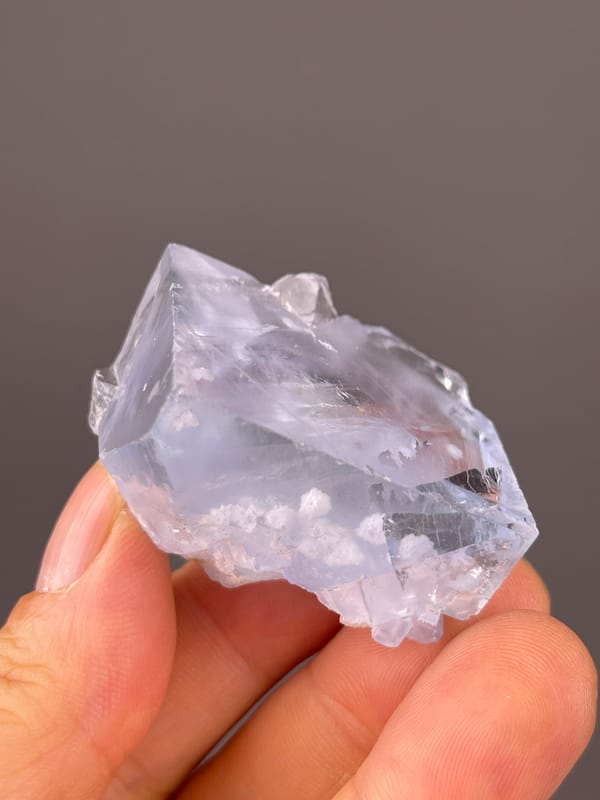 Blue Fluorite natural specimen highlighting pale-blue cleavage-modified faces clearly