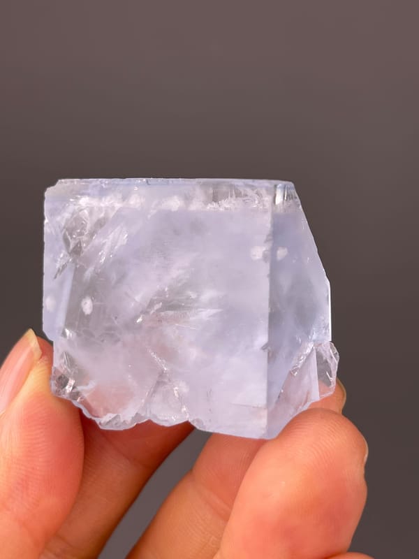 Blue Fluorite specimen bearing pale-blue cleavage-modified faces visibly