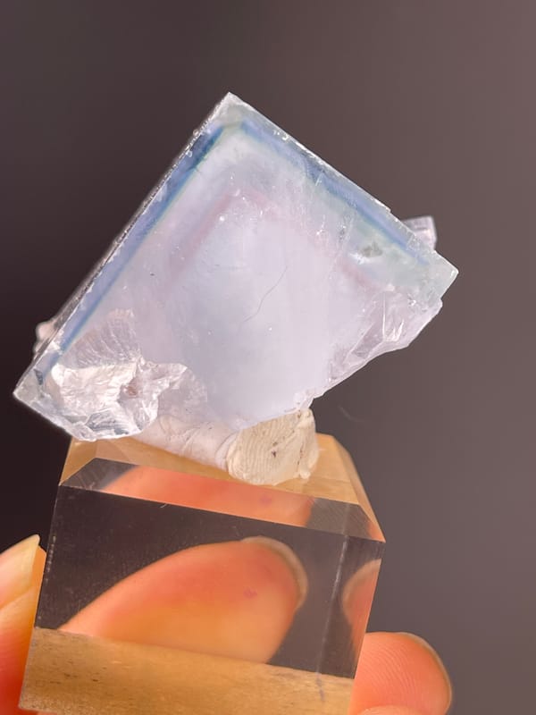Pale lavender cubic block on natural blue fluorite specimen from Xianghualing, Hunan, China