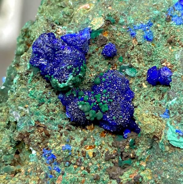 Green malachite crust with deep blue azurite balls from Anhui, China, view 3 of 9