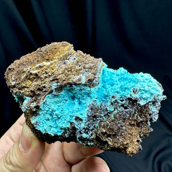 Turquoise-blue gibbsite crust with malachite on brown rock from Yunnan, China
