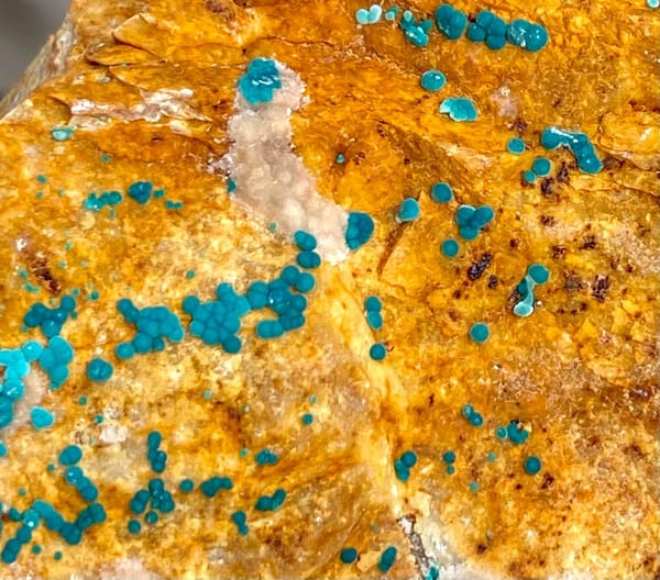 Orange block with green botryoidal malachite and blue copper spots from Yunnan, China, view 3 of 9