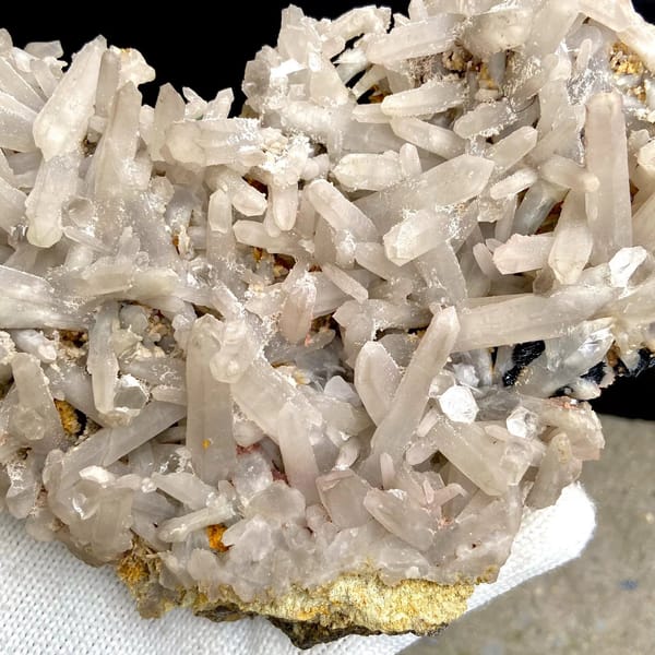 Plate of pale quartz prisms over botryoidal hematite from Inner Mongolia, China, view 5 of 9