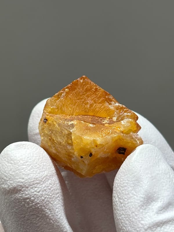 Bright orange scheelite crystal from Xuebaoding, Sichuan, China, view 2 of 5