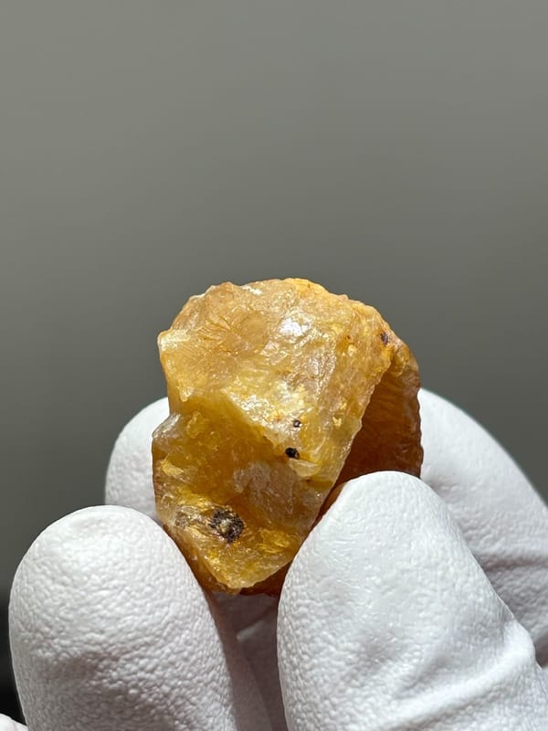 Bright orange scheelite crystal from Xuebaoding, Sichuan, China, view 5 of 5