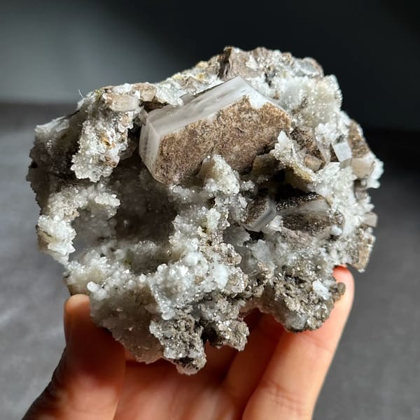Brown hexagonal calcite plate on grey quartz from Fujian, China, view 4 of 12