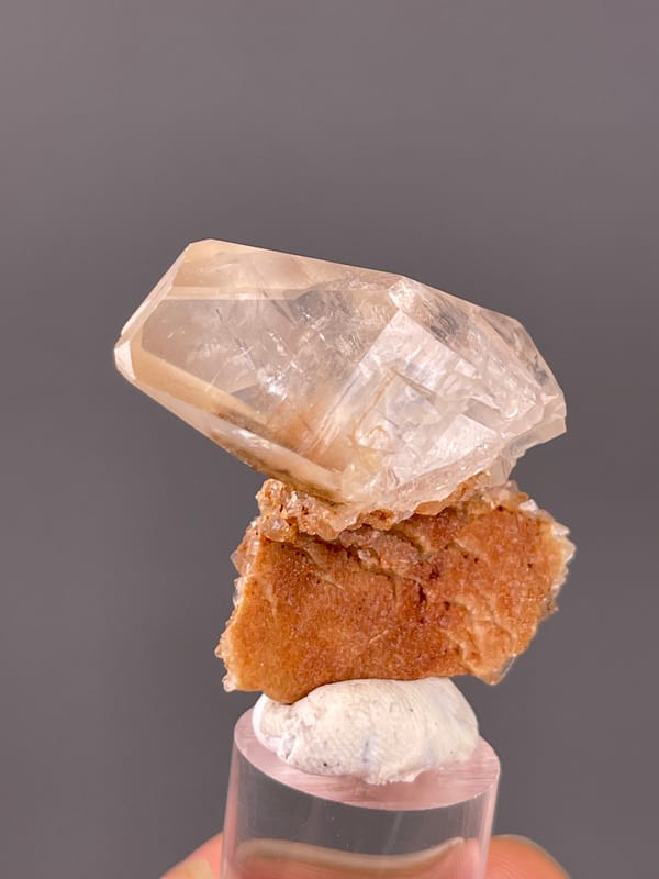 Calcite specimen from Daye, Hubei, China, defined by clear prismatic crystal on brown matrix