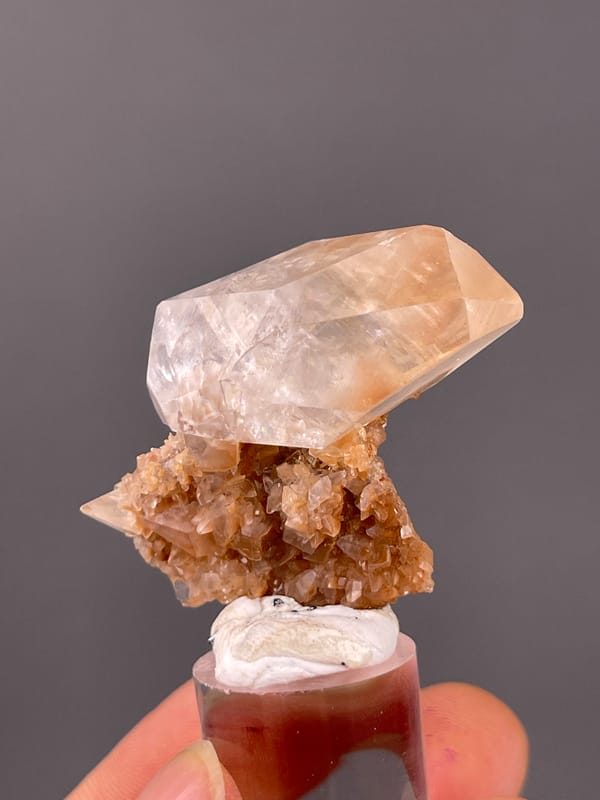 Clear prismatic crystal on brown matrix on natural calcite specimen from Daye, Hubei, China
