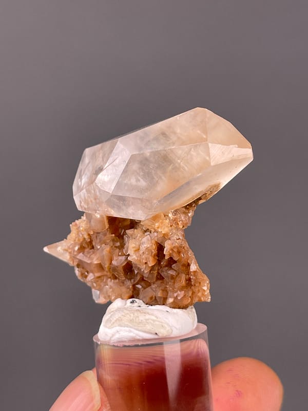 Calcite specimen from Daye, Hubei, China highlighting clear prismatic crystal on brown matrix