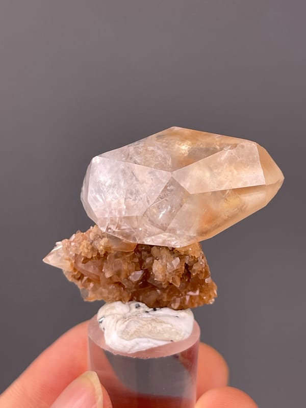 Calcite specimen from Daye, Hubei, China, characterized by clear prismatic crystal on brown matrix