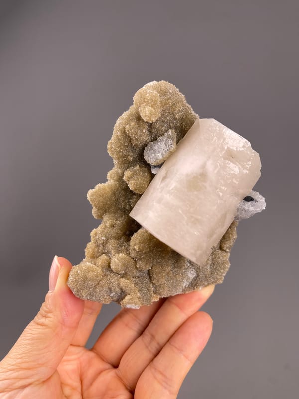 Calcite from Fujian, China: cloudy cream face and white clusters.