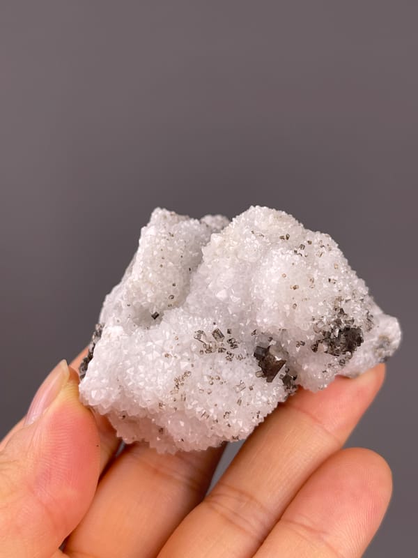 Calcite from Fujian, China: oblique view of brown crystals within white druse.