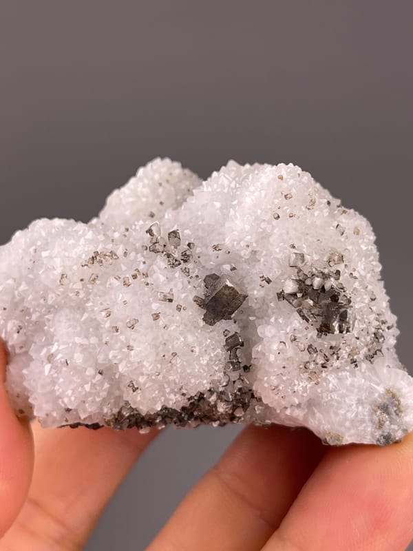 Calcite from Fujian, China: close view of small brown crystals in white quartz.