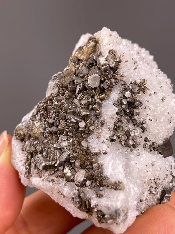 Calcite from Fujian, China: brown crystal-rich face bordered by white quartz.