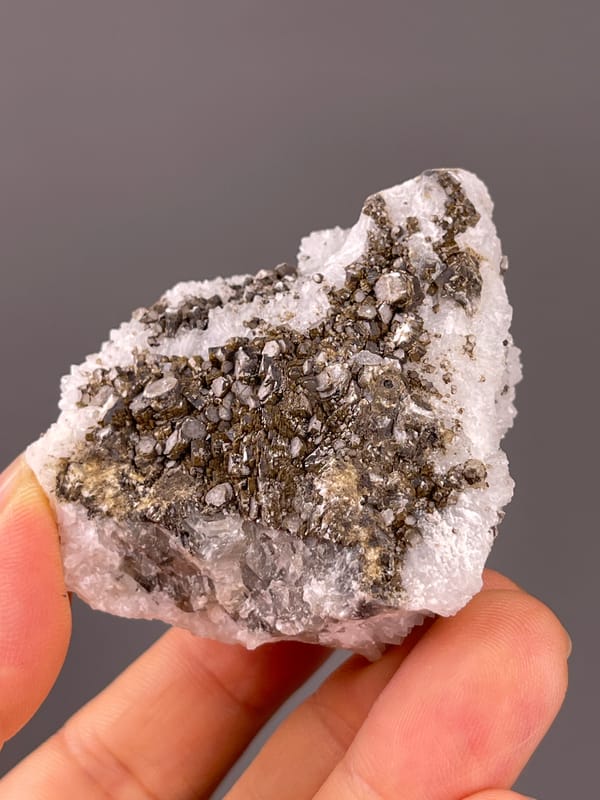 Calcite from Fujian, China: side profile of the brown crystal-covered face.