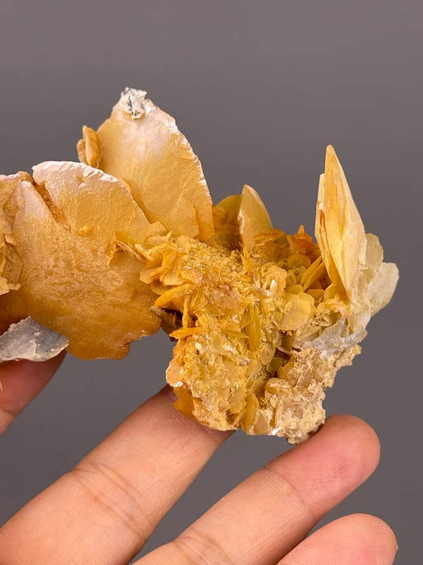 Calcite from Guangdong, China: wide plate and small clustered edge growths.