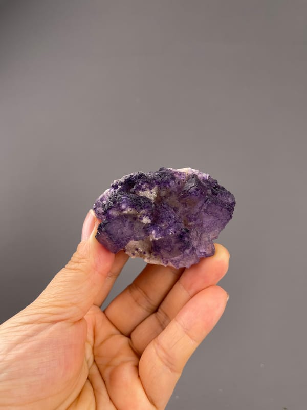 Calcite from Guizhou, China: distant full specimen with a broad low purple outline.