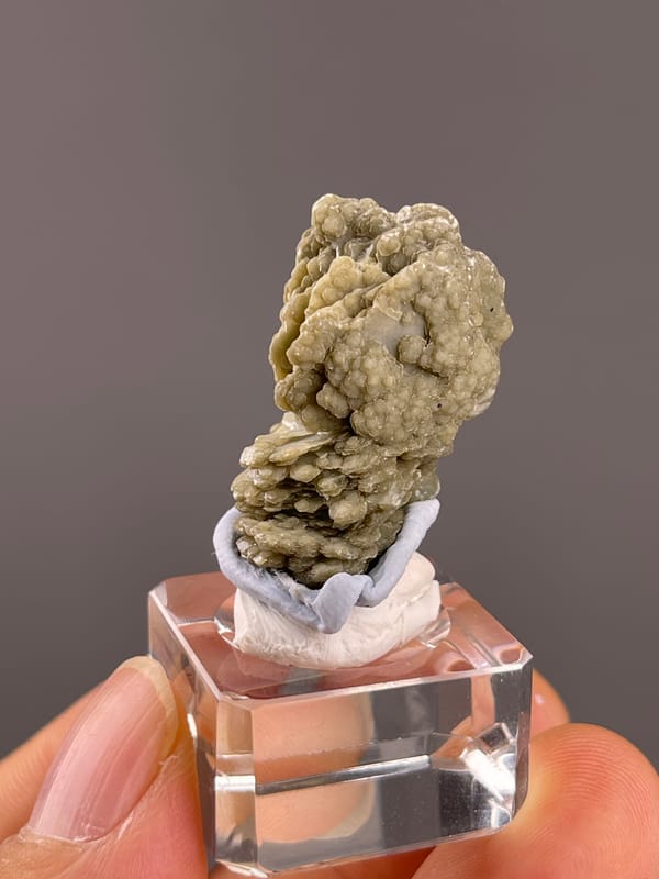 Calcite from Huanggangliang, Inner Mongolia, China: front view of nodular upper growths and layered lower section.