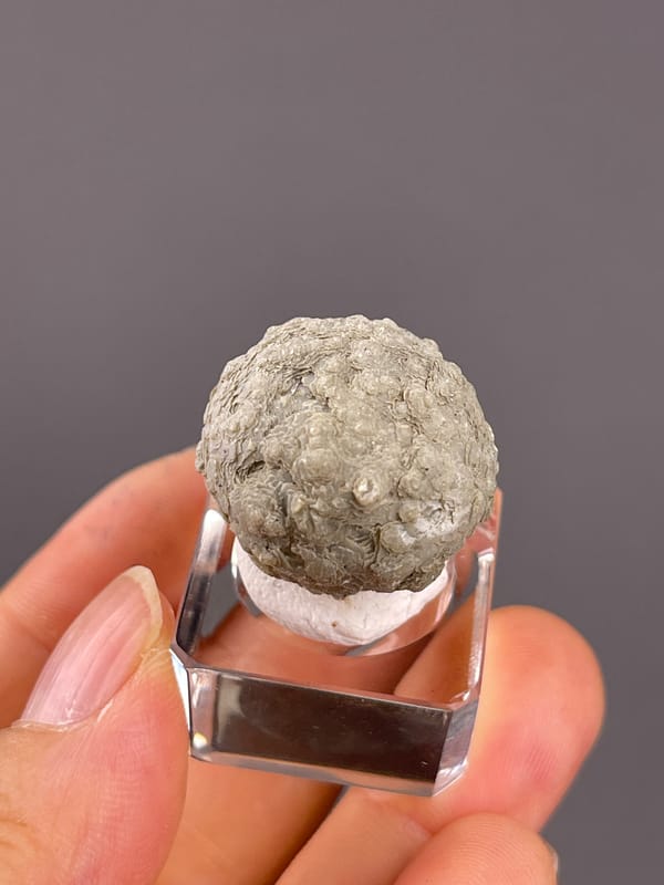 Calcite from Huanggangliang, Inner Mongolia, China: angled view of the compact rounded specimen.