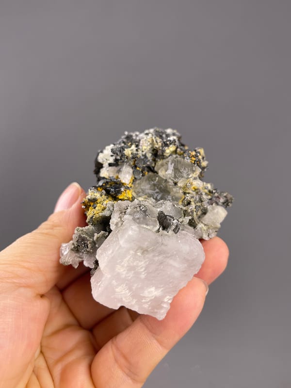 Calcite from Inner Mongolia, China: inverted view with a broad pale crystal at the lower edge.