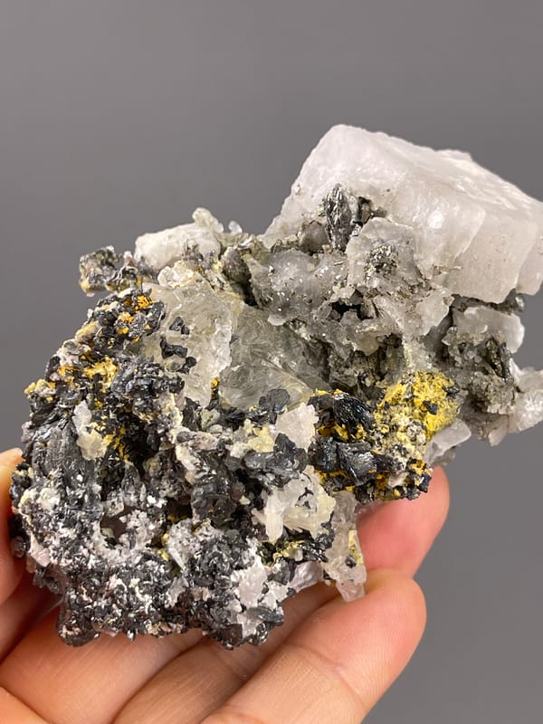 Calcite from Inner Mongolia, China: angled view of the pale block and gray crystalline center.