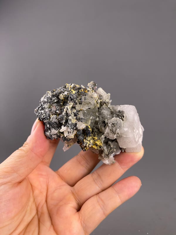 Calcite from Inner Mongolia, China: whole horizontal association held above the palm.