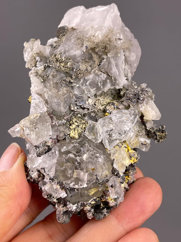 Calcite from Inner Mongolia, China: reverse view showing broad gray faces and the pale end.