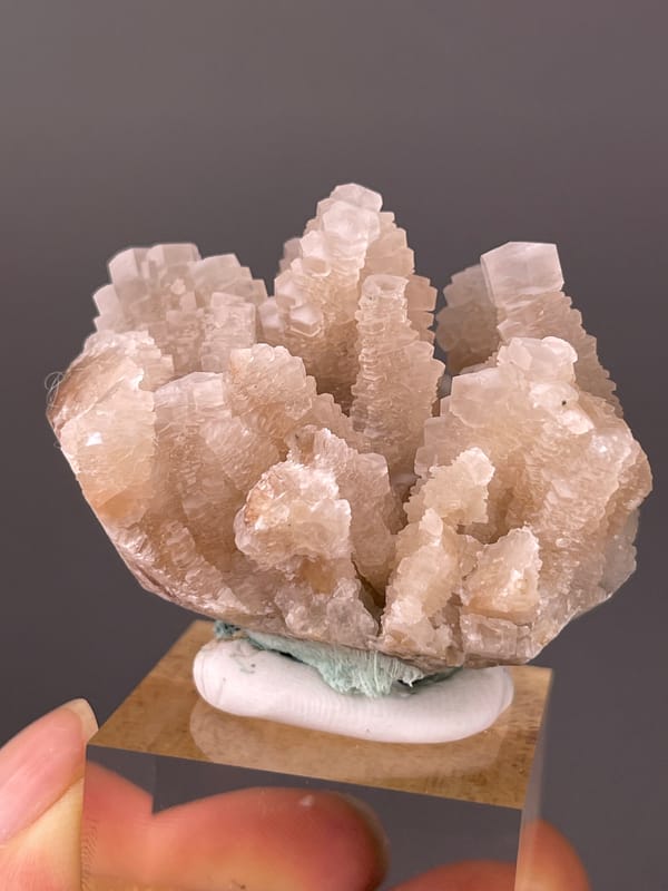 Calcite specimen from Longyan, Fujian, China featuring peach stacked calcite crystals