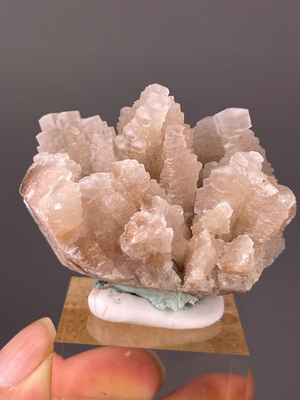 Calcite specimen from Longyan, Fujian, China showing peach stacked calcite crystals