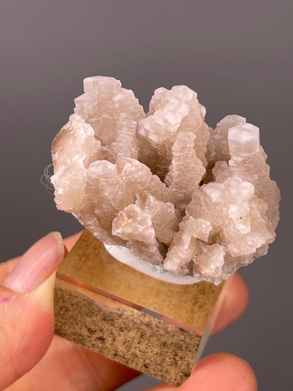 Calcite specimen from Longyan, Fujian, China displaying peach stacked calcite crystals