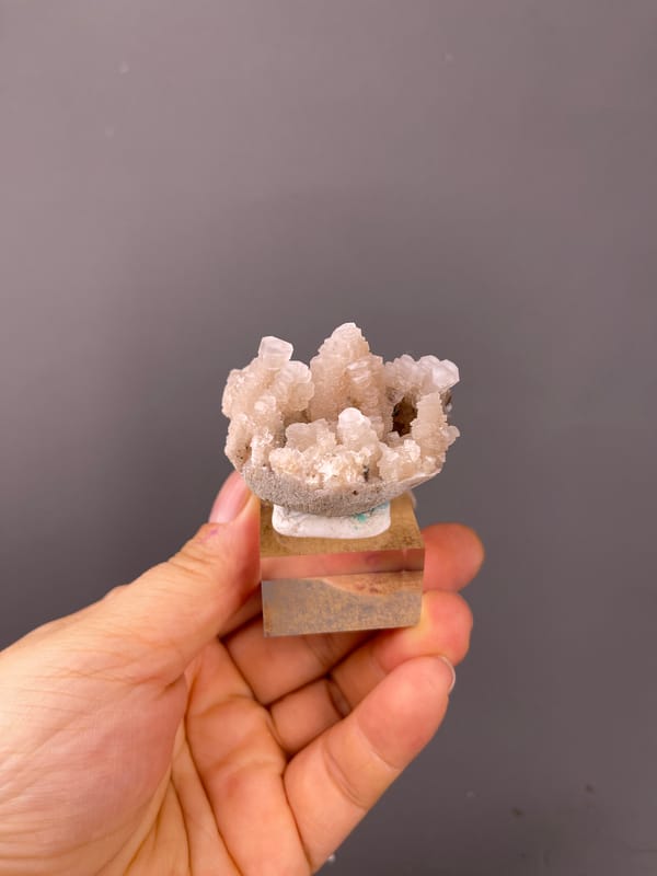 Calcite specimen from Longyan, Fujian, China bearing peach stacked calcite crystals