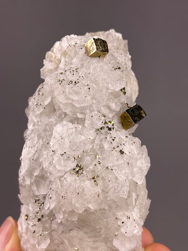 Calcite from Longyan, Fujian, China: upright view showing two prominent brassy blocks.