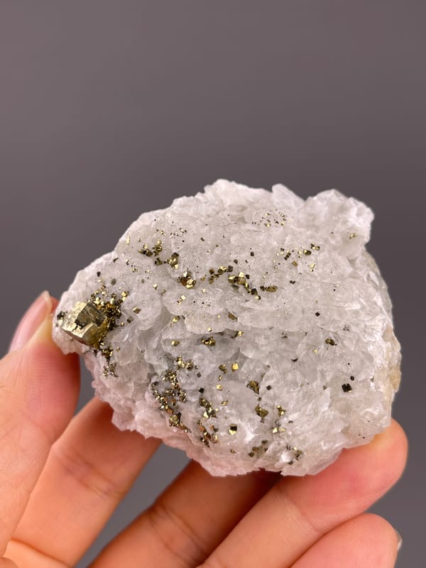 Calcite from Longyan, Fujian, China: horizontal view of the white crystalline surface.
