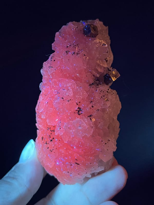 Calcite from Longyan, Fujian, China: pink fluorescence view with metallic areas remaining dark.