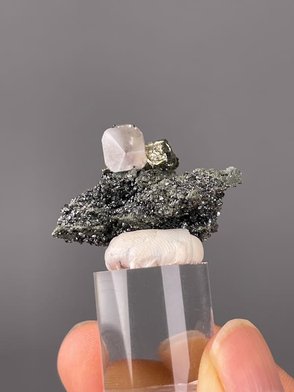 Calcite specimen from Shizhuyuan Mine, Hunan, China featuring milky calcite on sparkling matrix