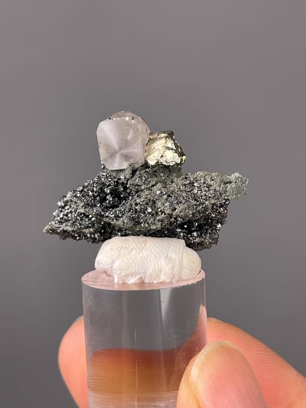 Calcite specimen from Shizhuyuan Mine, Hunan, China showing milky calcite on sparkling matrix