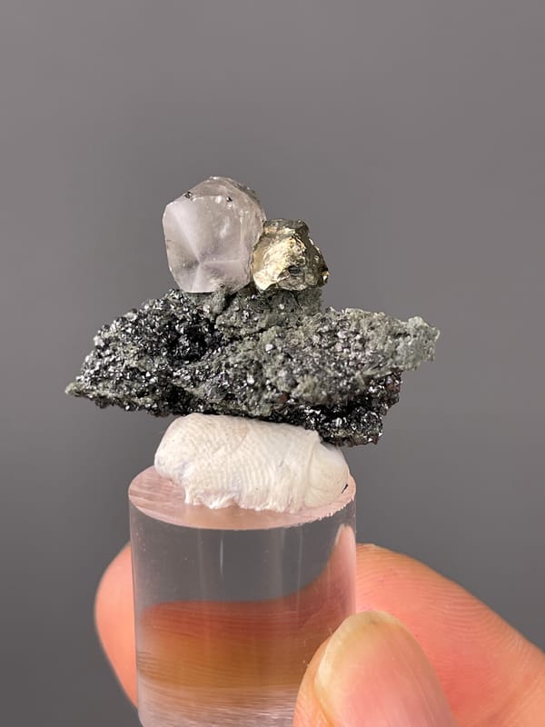 Calcite specimen from Shizhuyuan Mine, Hunan, China, defined by milky calcite on sparkling matrix