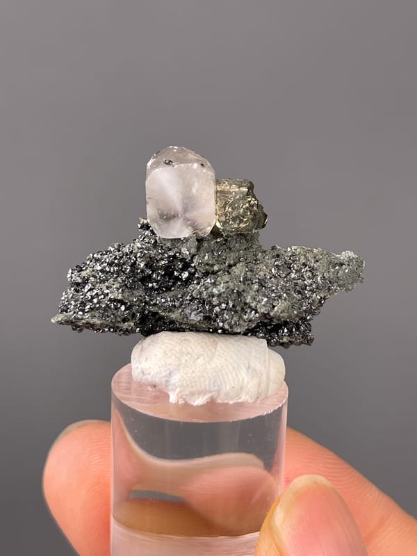 Calcite specimen from Shizhuyuan Mine, Hunan, China presenting milky calcite on sparkling matrix