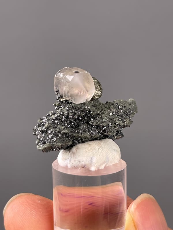 Milky calcite on sparkling matrix visible on calcite specimen from Shizhuyuan Mine, Hunan, China