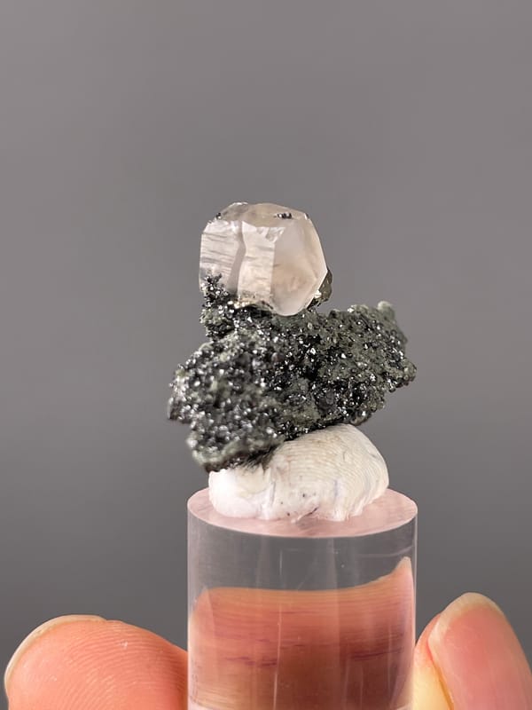 Calcite specimen from Shizhuyuan Mine, Hunan, China displaying milky calcite on sparkling matrix