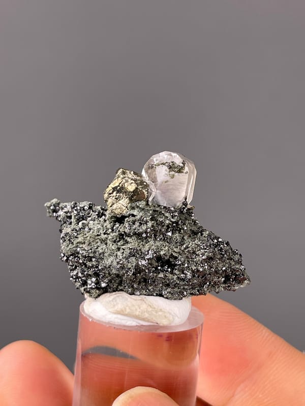 Calcite specimen from Shizhuyuan Mine, Hunan, China highlighting milky calcite on sparkling matrix