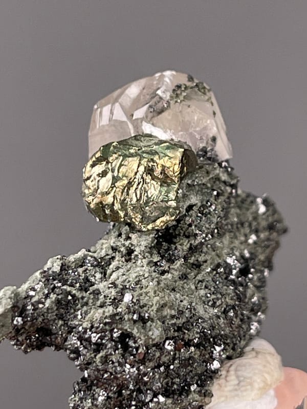 Calcite specimen from Shizhuyuan Mine, Hunan, China, characterized by milky calcite on sparkling matrix