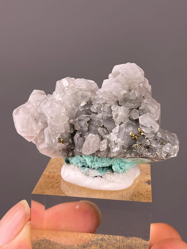 Calcite specimen from Longyan, Fujian, China featuring pale gray calcite with brassy pyrite