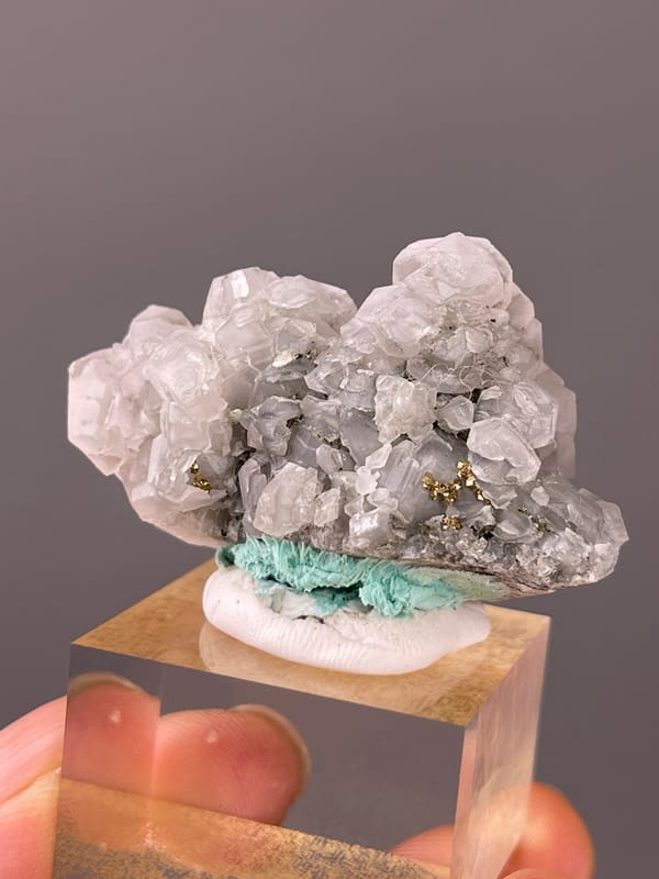 Calcite specimen from Longyan, Fujian, China, defined by pale gray calcite with brassy pyrite