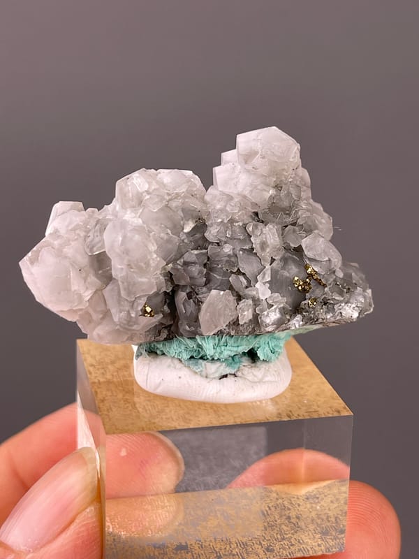 Calcite specimen from Longyan, Fujian, China presenting pale gray calcite with brassy pyrite