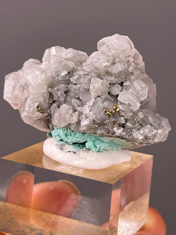 Pale gray calcite with brassy pyrite visible on calcite specimen from Longyan, Fujian, China