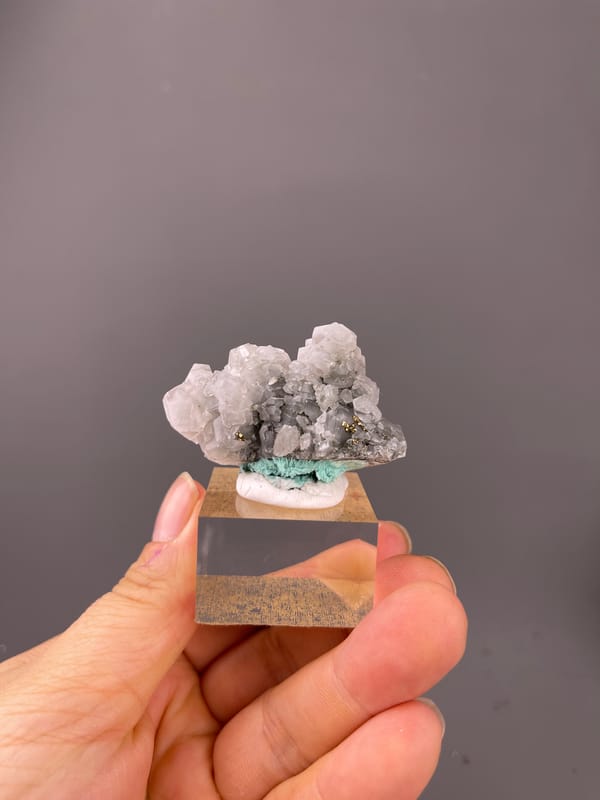 Pale gray calcite with brassy pyrite on natural calcite specimen from Longyan, Fujian, China
